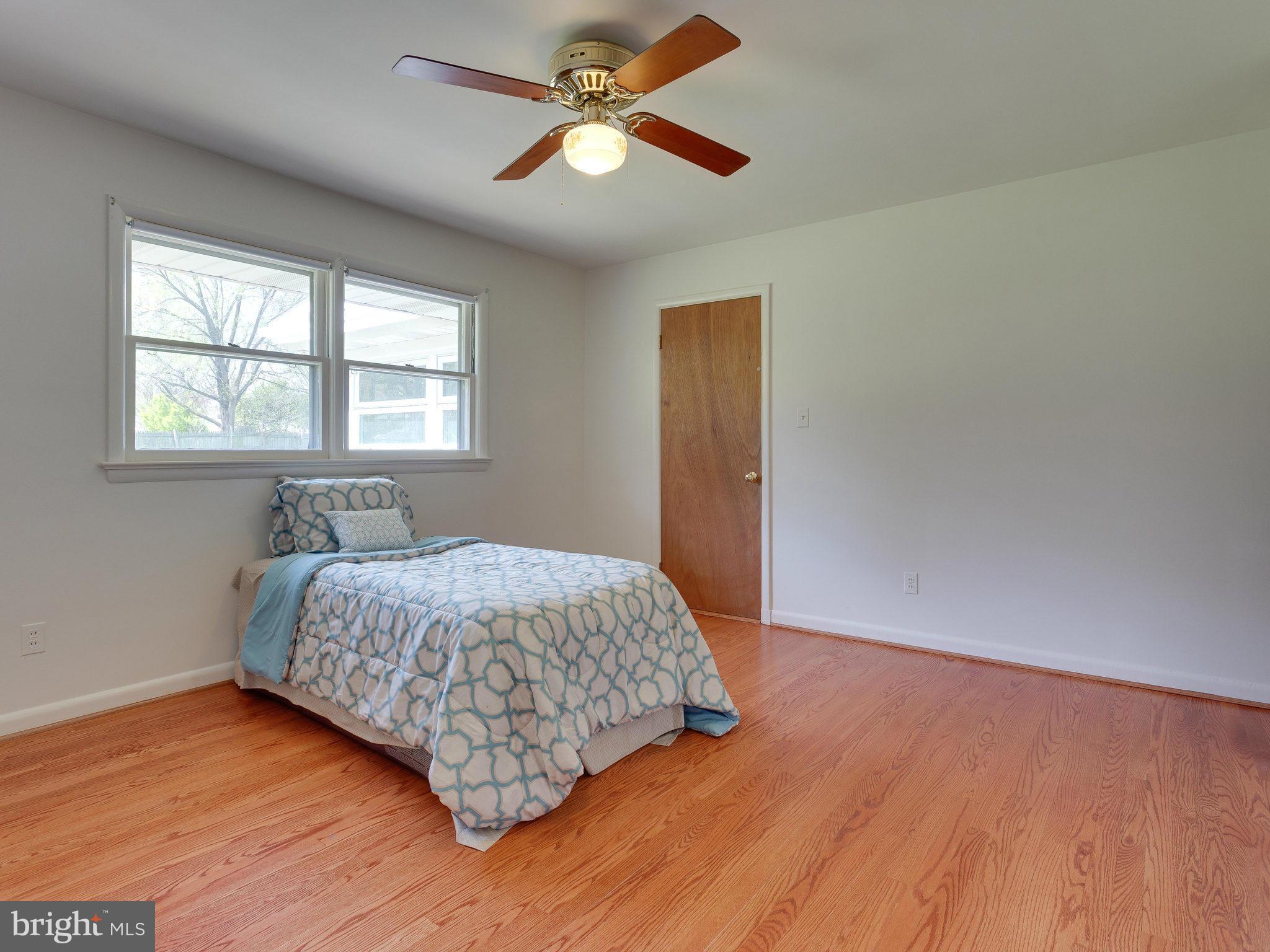 6714 Greenleaf Street Springfield, VA 22150 - Photo 25 of 30 a bedroom with a bed and a window
