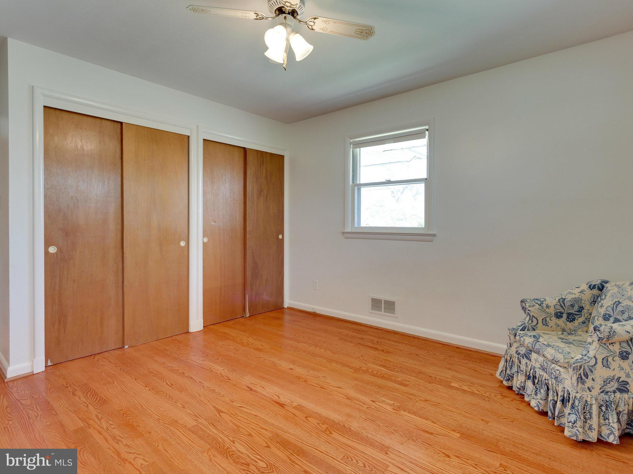 6714 Greenleaf Street Springfield, VA 22150 - Photo 27 of 30 a view of an empty room with wooden floor and a window