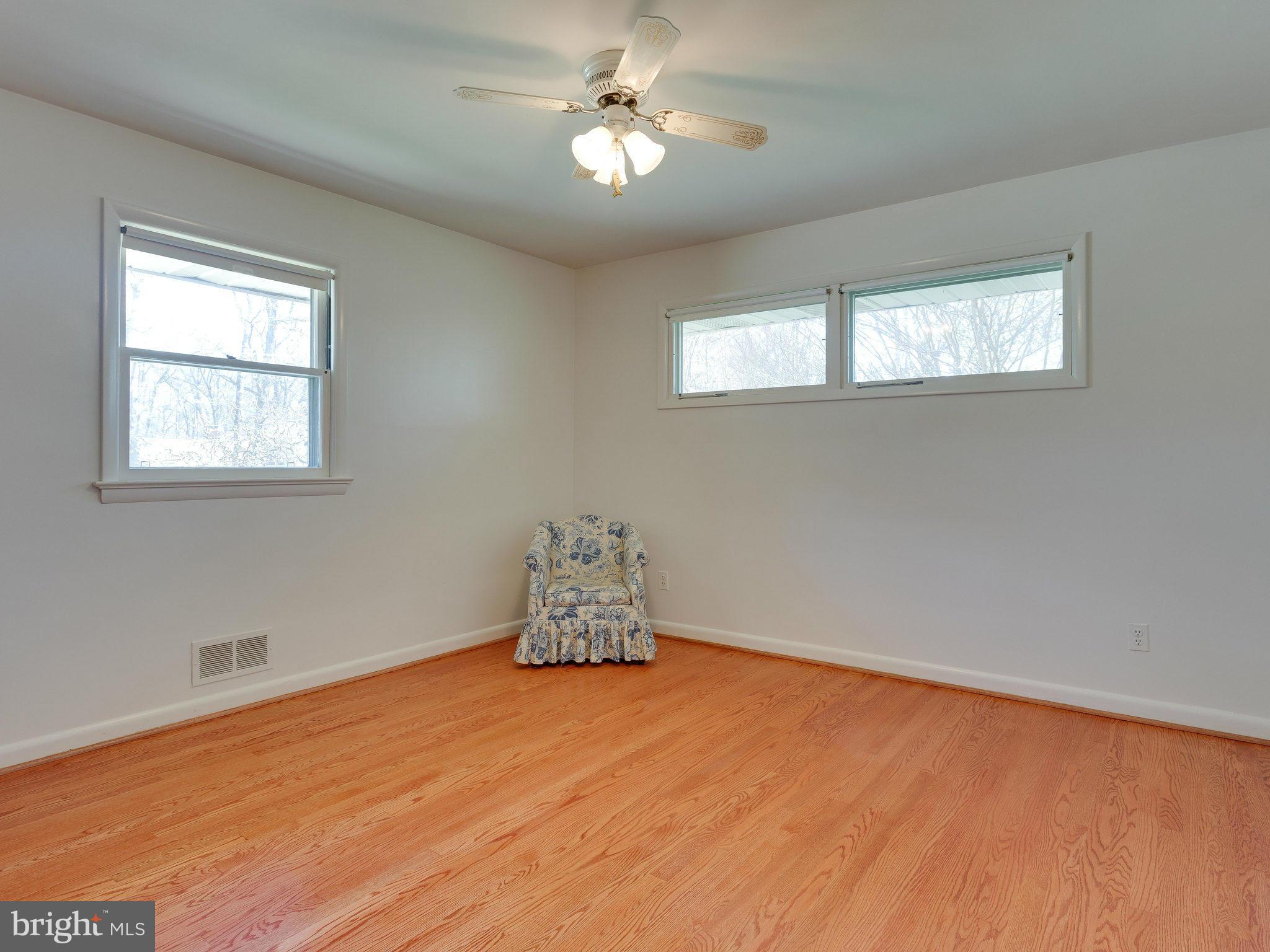 6714 Greenleaf Street Springfield, VA 22150 - Photo 28 of 30 a room with chandelier fan and windows