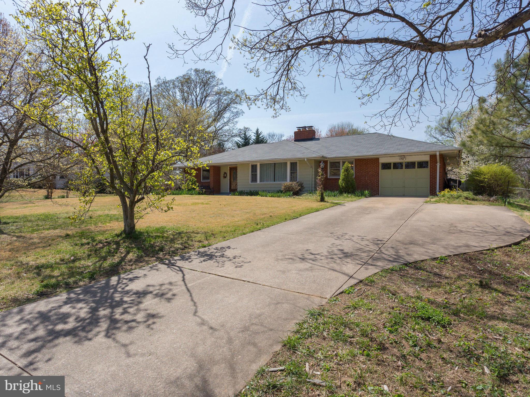 6714 Greenleaf Street Springfield, VA 22150 - Photo 29 of 30 a front view of a house with a yard and trees