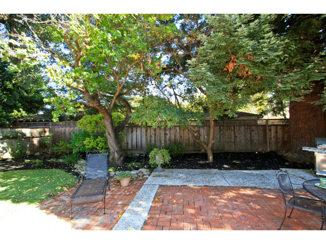 342 Willow Road Menlo Park, CA 94025 - Photo 15 of 15 a view of backyard with potted plants and large trees