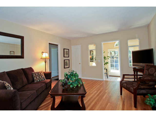 342 Willow Road Menlo Park, CA 94025 - Photo 4 of 15 a living room with furniture and a flat screen tv