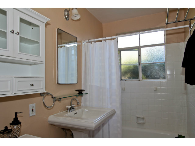 342 Willow Road Menlo Park, CA 94025 - Photo 10 of 15 a bathroom with a sink and a mirror