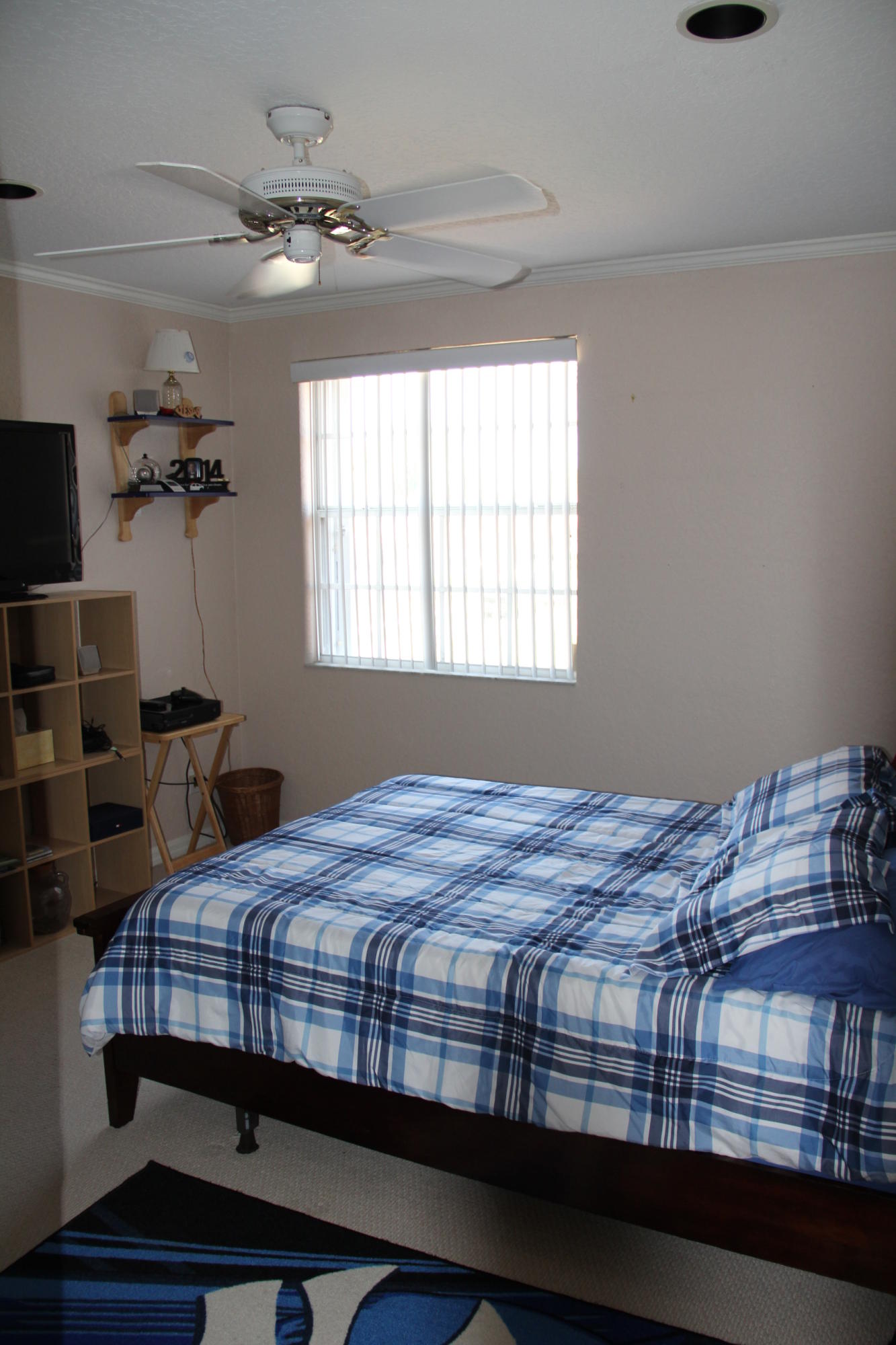 7354 Michigan Isle Road Lake Worth, FL 33467 - Photo 11 of 21 a bedroom with a bed a dresser and a window