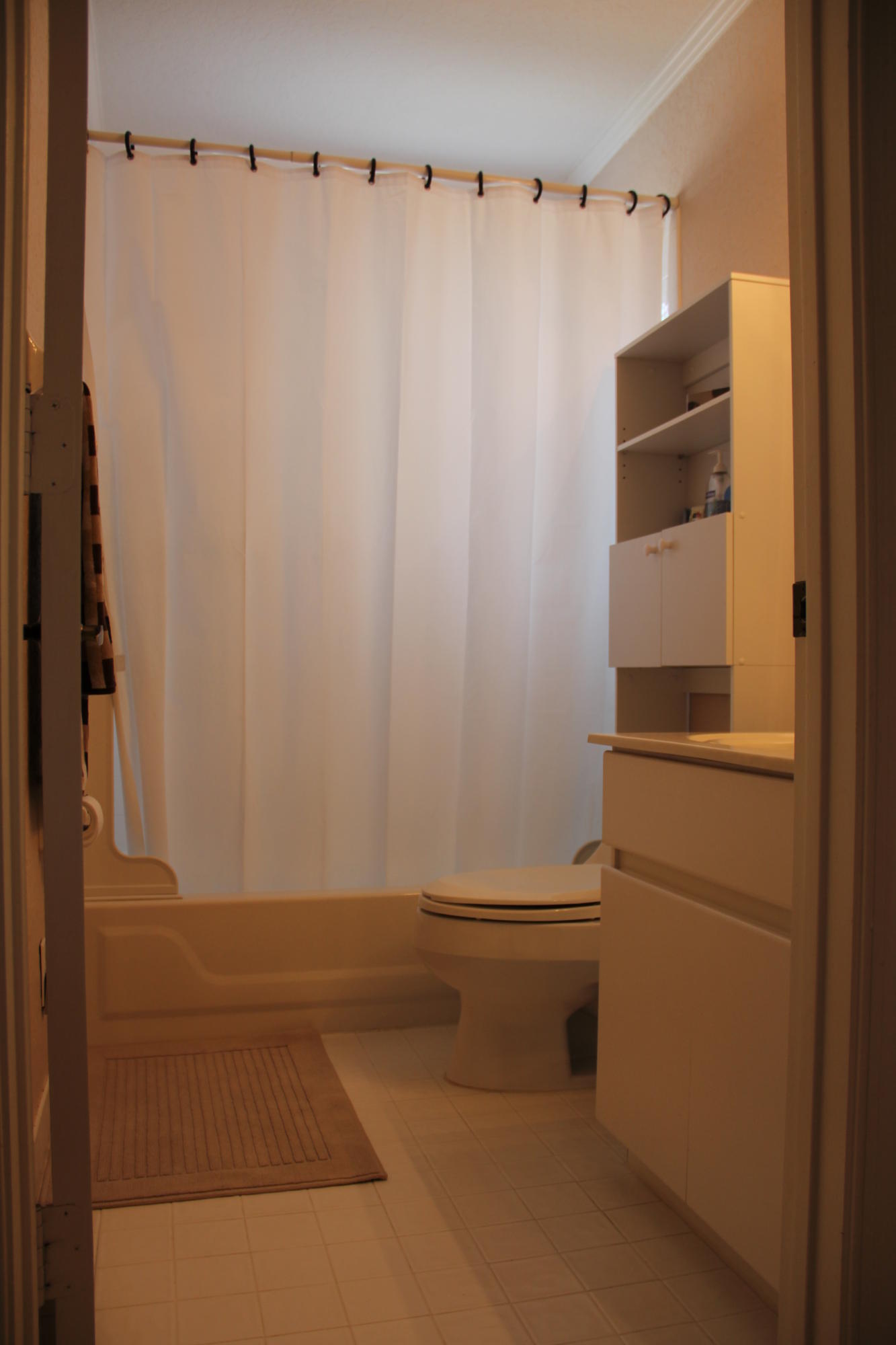 7354 Michigan Isle Road Lake Worth, FL 33467 - Photo 12 of 21 a bathroom with a shower and a sink