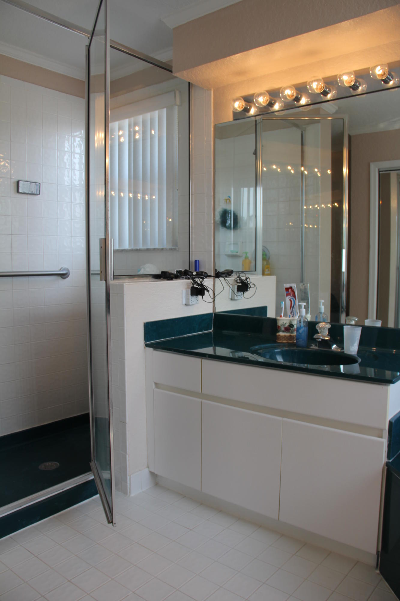 7354 Michigan Isle Road Lake Worth, FL 33467 - Photo 14 of 21 a bathroom with a double vanity sink and mirror