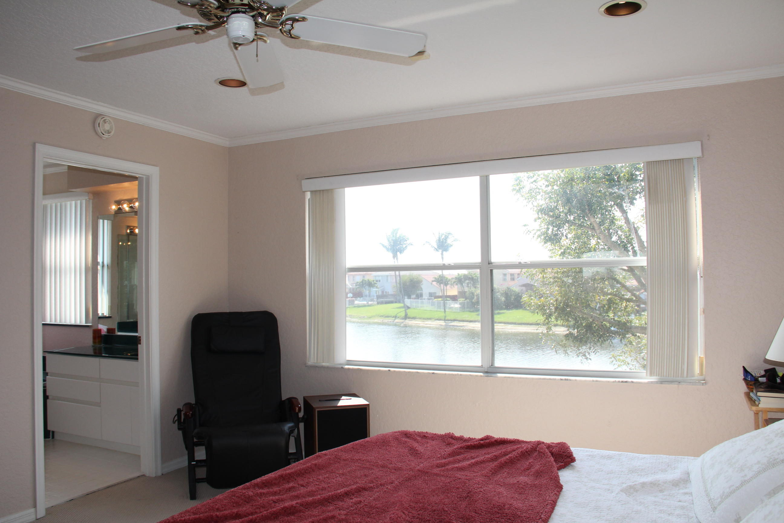 7354 Michigan Isle Road Lake Worth, FL 33467 - Photo 16 of 21 a bedroom with a bed and a window