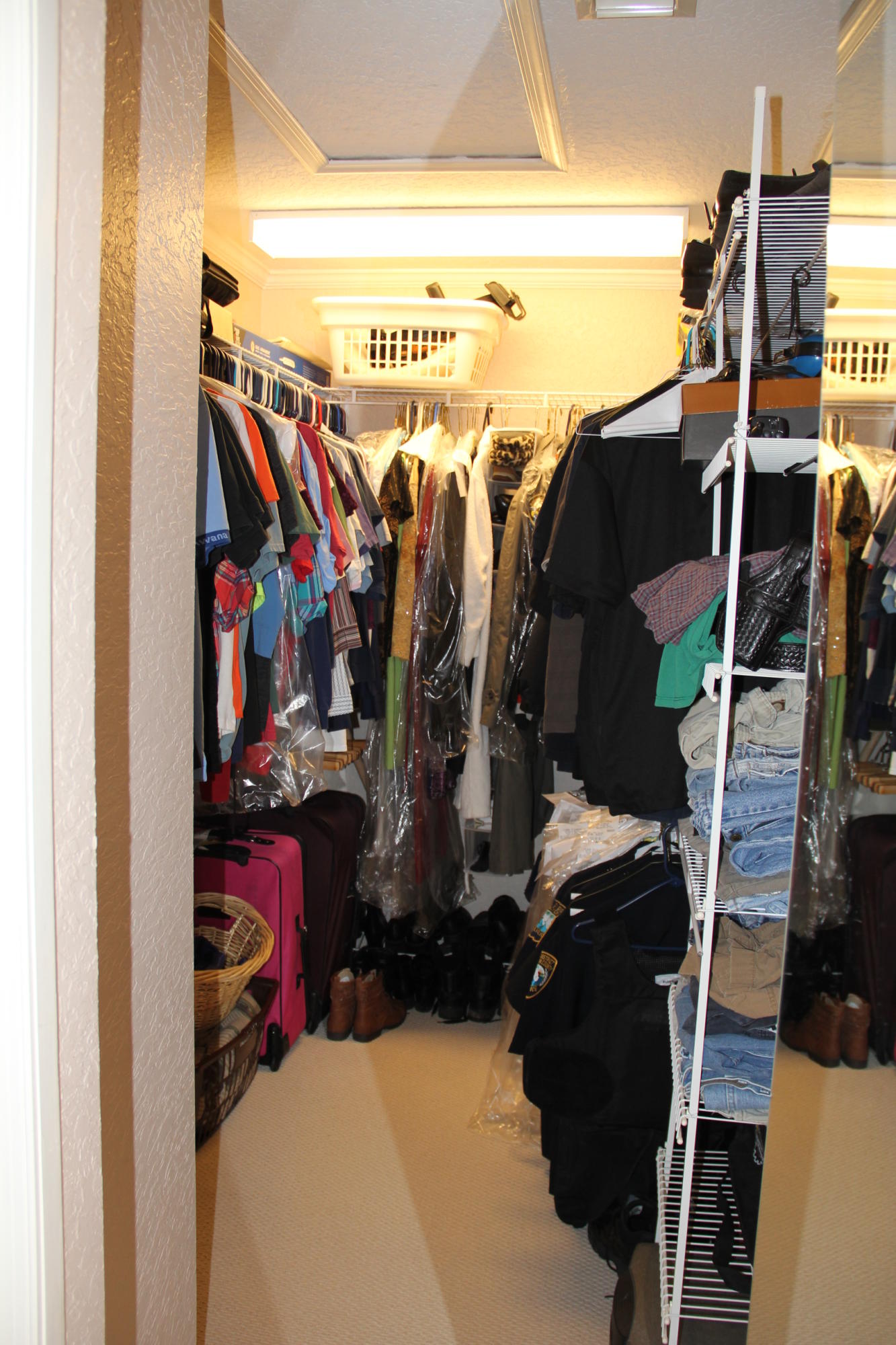 7354 Michigan Isle Road Lake Worth, FL 33467 - Photo 17 of 21 a view of walk in closet with clothes