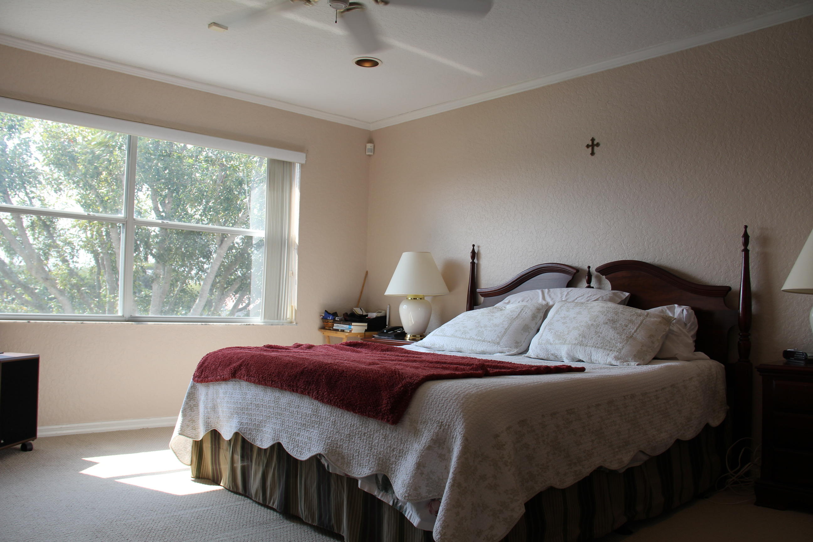 7354 Michigan Isle Road Lake Worth, FL 33467 - Photo 18 of 21 a bedroom with a bed and window