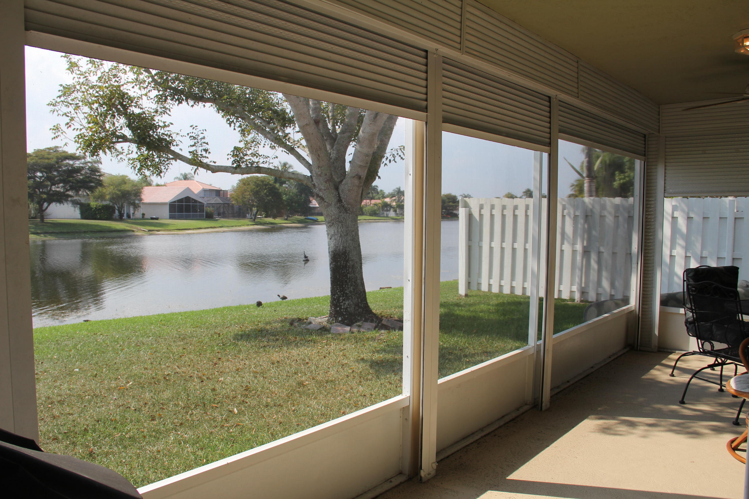 7354 Michigan Isle Road Lake Worth, FL 33467 - Photo 19 of 21 a view of a floor to ceiling window next to a yard