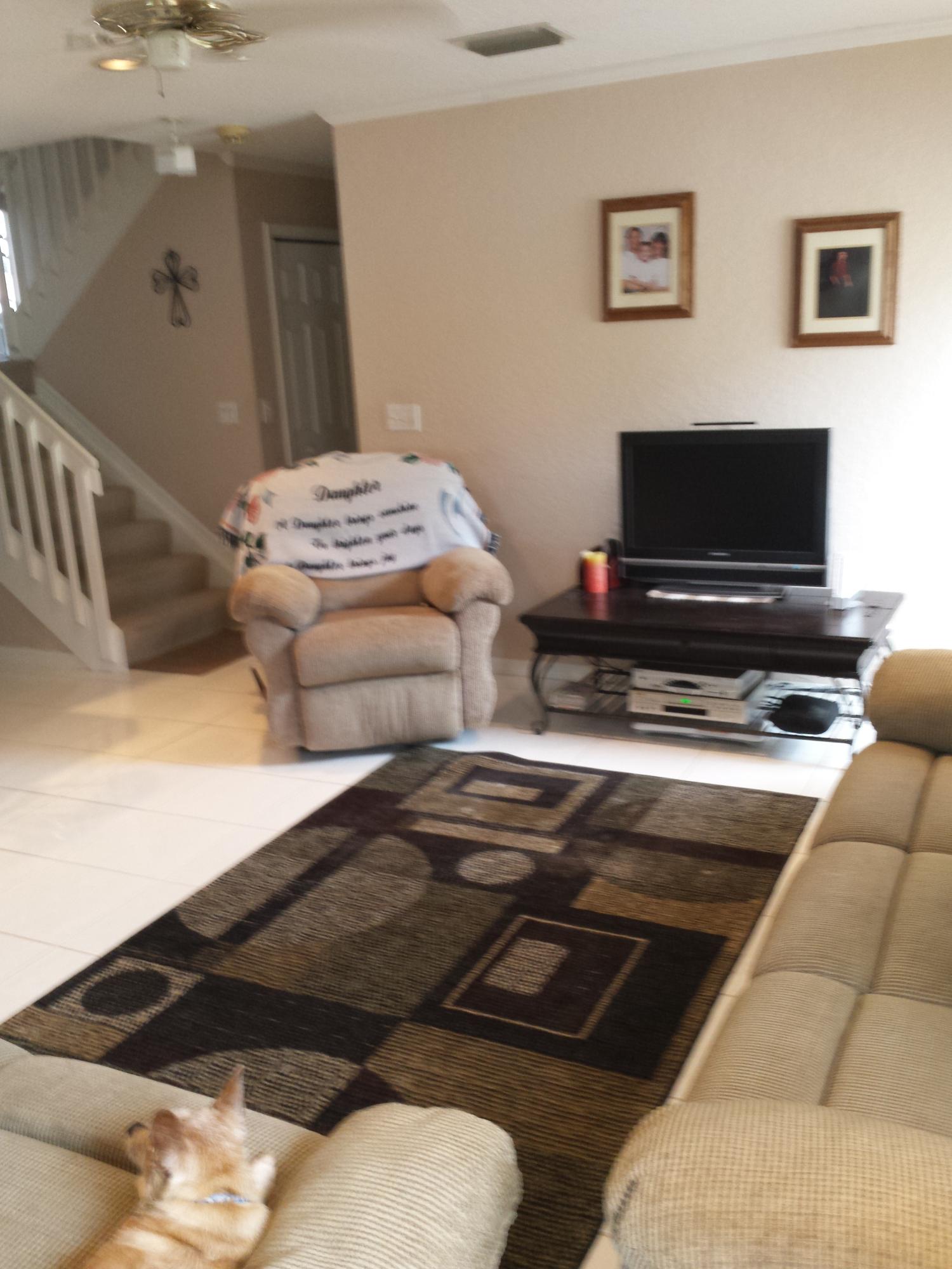 7354 Michigan Isle Road Lake Worth, FL 33467 - Photo 21 of 21 a bedroom with furniture and a flat screen tv