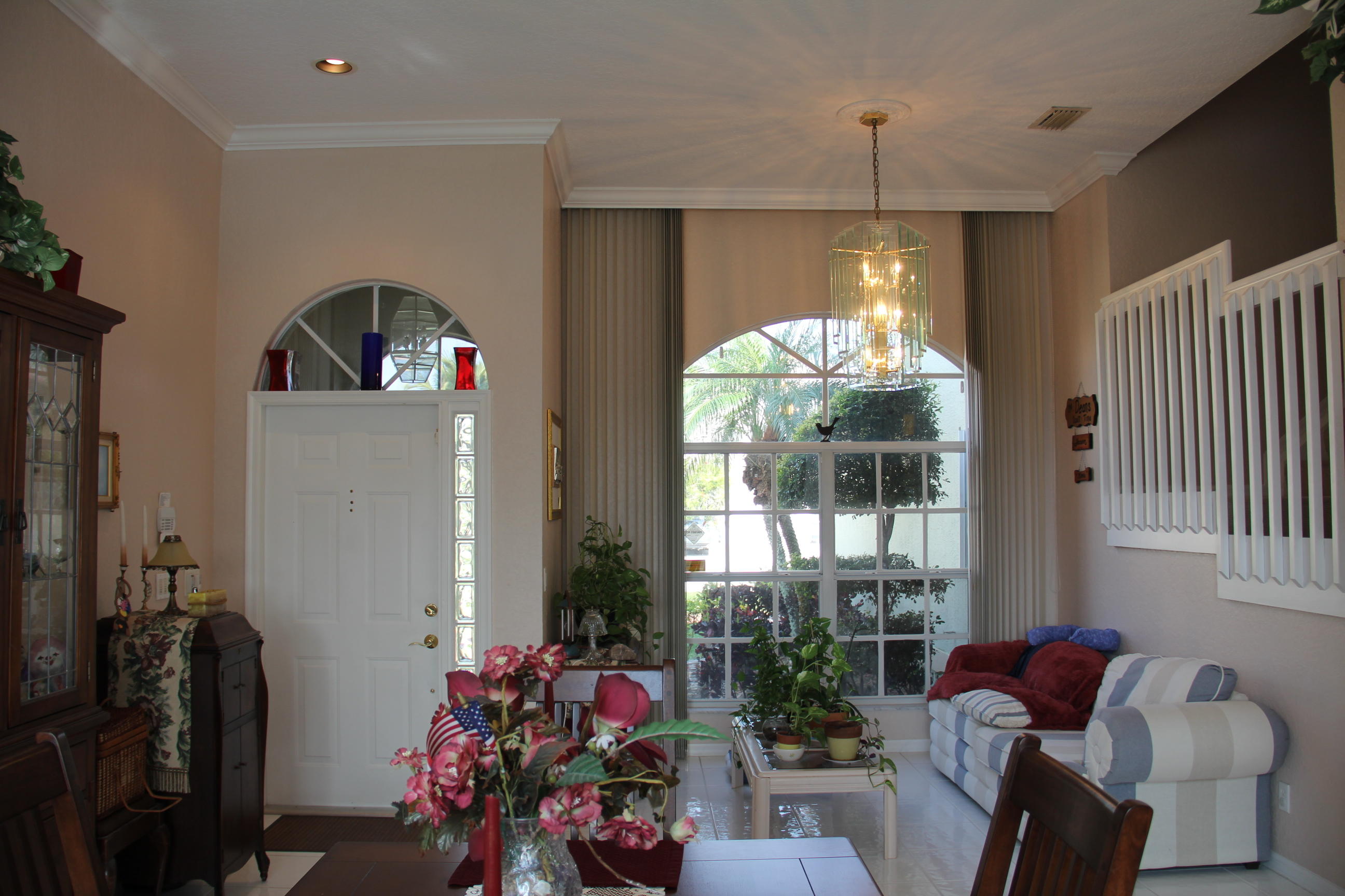 7354 Michigan Isle Road Lake Worth, FL 33467 - Photo 3 of 21 a room with furniture and a large window