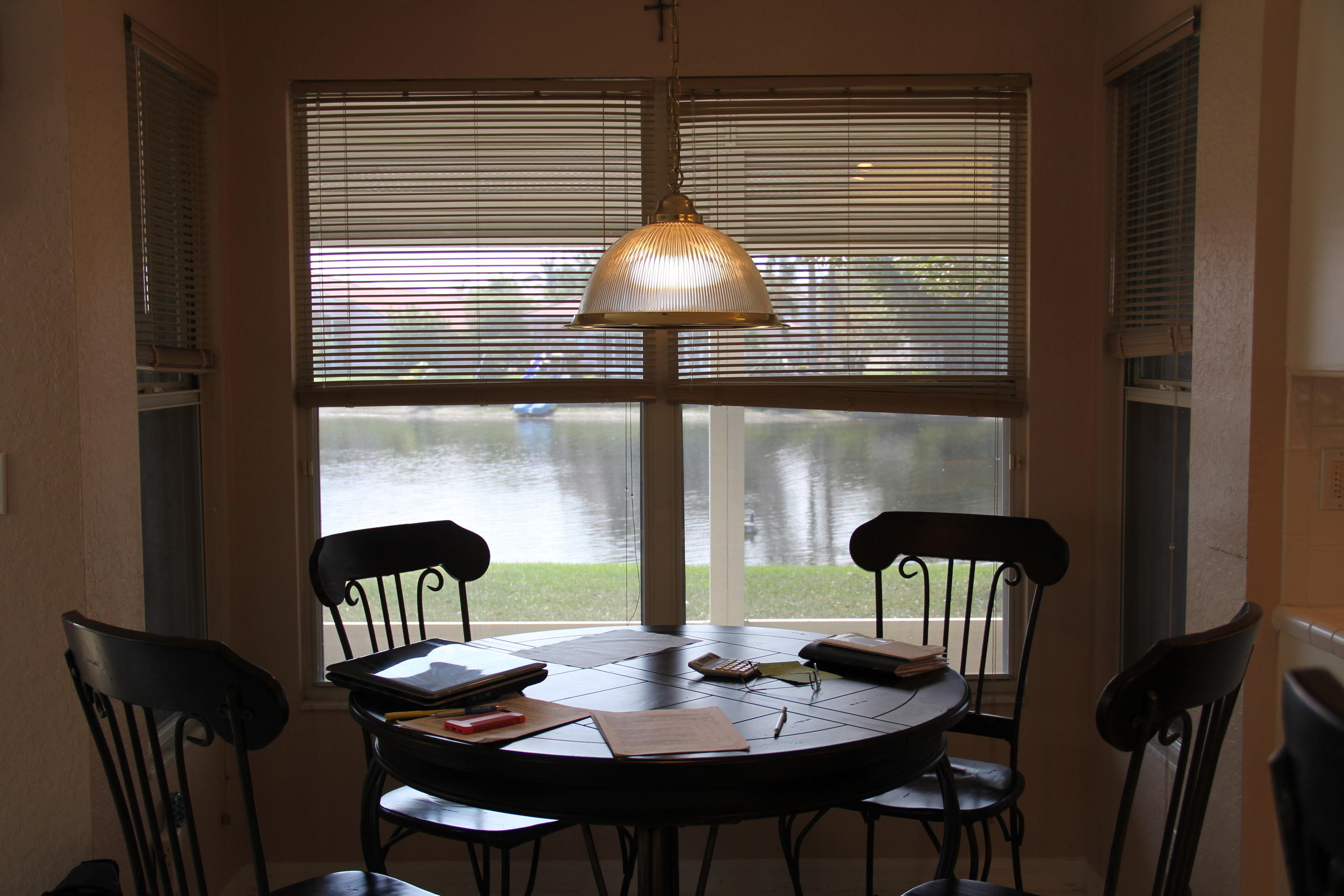 7354 Michigan Isle Road Lake Worth, FL 33467 - Photo 7 of 21 a dining room with furniture and window