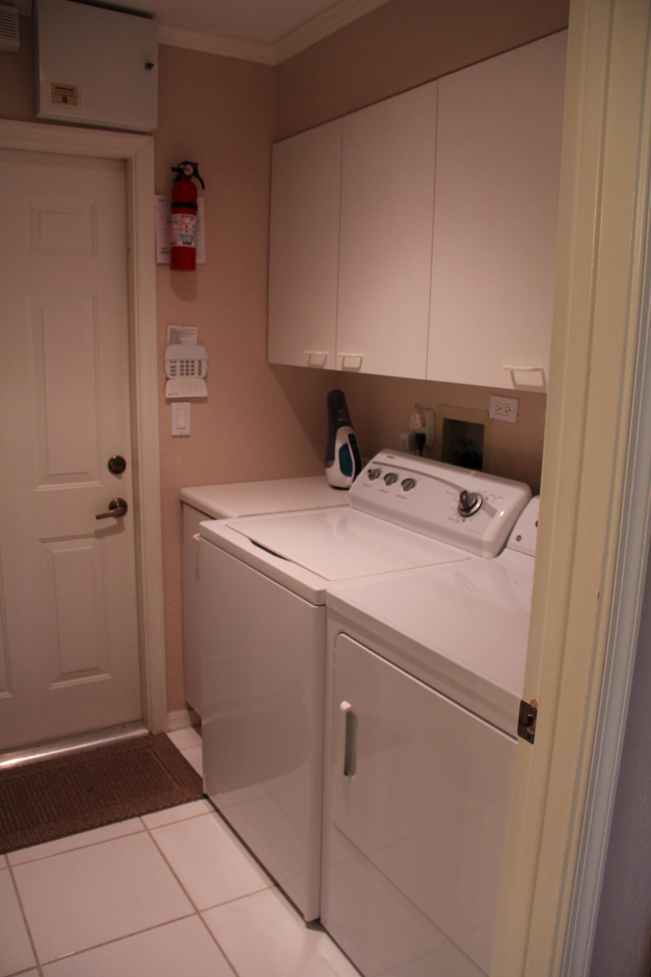 7354 Michigan Isle Road Lake Worth, FL 33467 - Photo 10 of 21 a utility room with dryer and washer