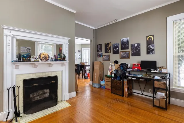 a living room with furniture and a fireplace