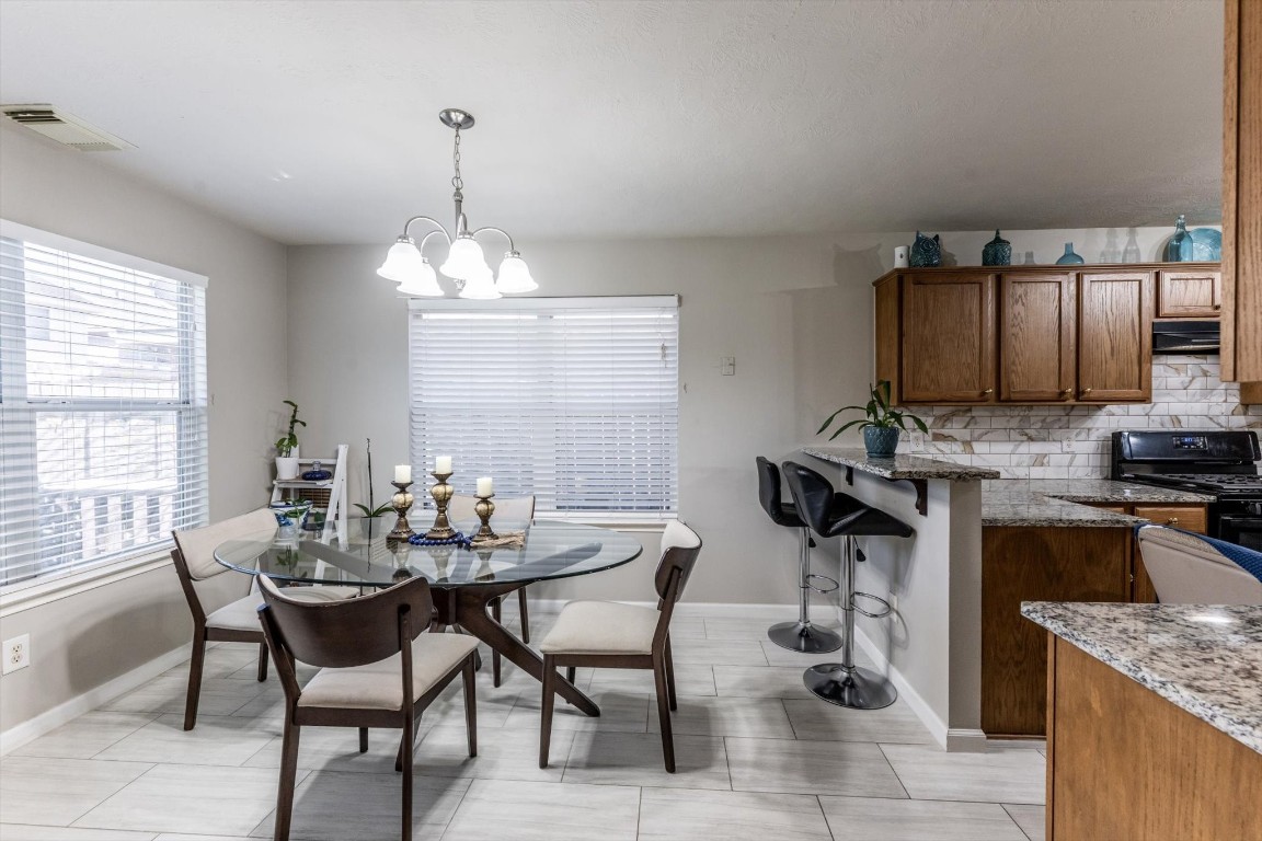 13507 Beech Ridge Lane Houston, TX 77083 - Photo 13 of 49 a view of a dining room with furniture