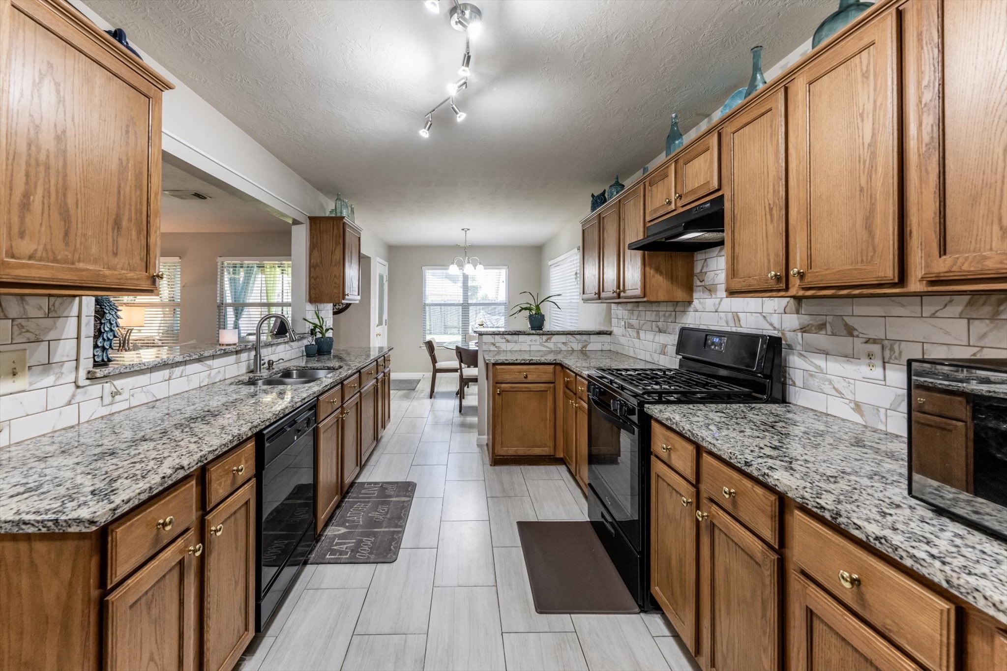 13507 Beech Ridge Lane Houston, TX 77083 - Photo 14 of 49 a large kitchen with stainless steel appliances granite countertop a stove sink and cabinets