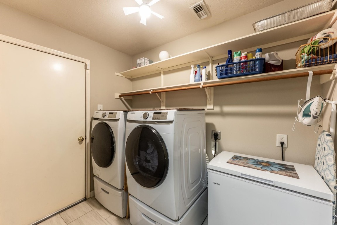 13507 Beech Ridge Lane Houston, TX 77083 - Photo 22 of 49 a utility room with dryer and washer