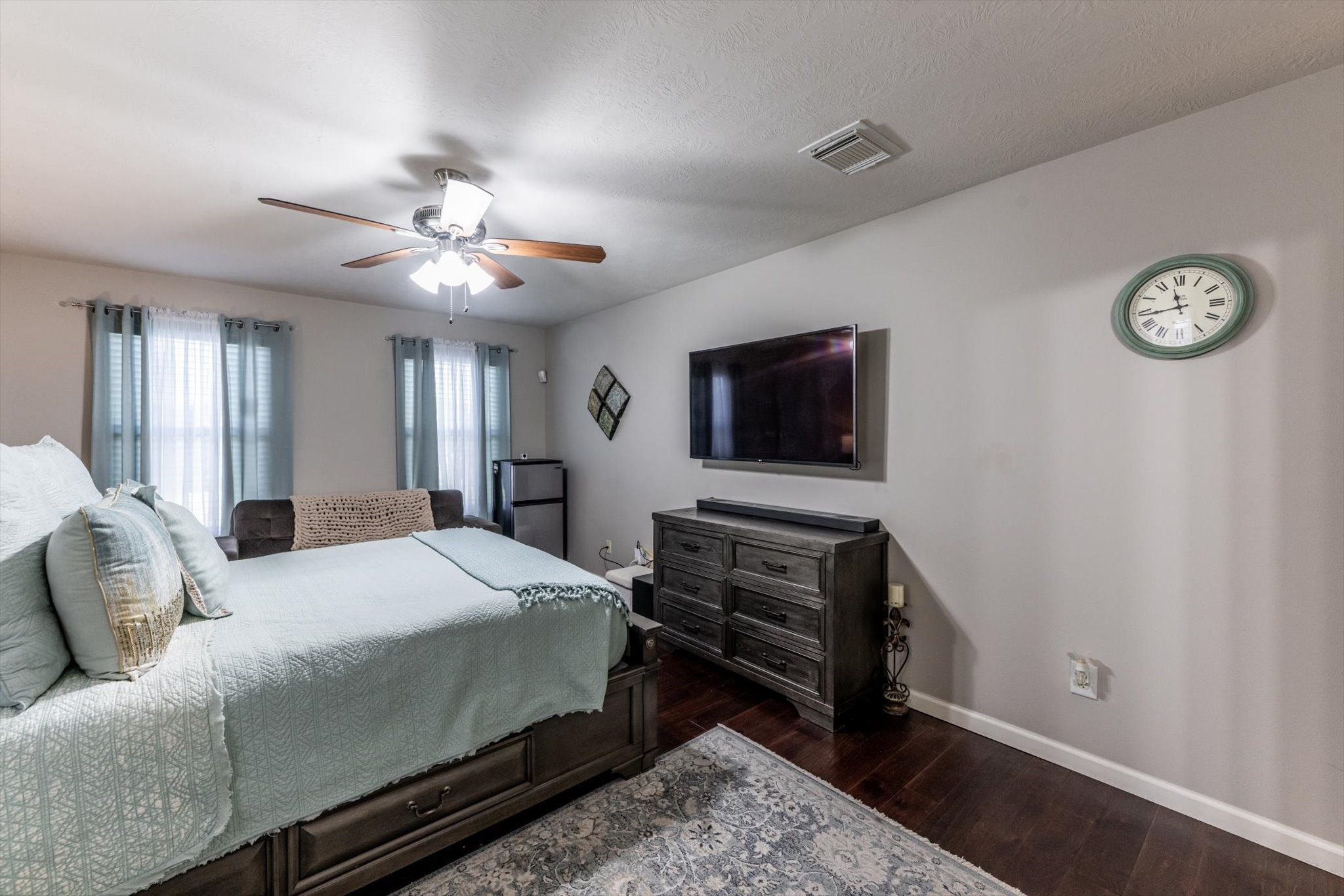 13507 Beech Ridge Lane Houston, TX 77083 - Photo 24 of 49 a bedroom with a bed and a chandelier