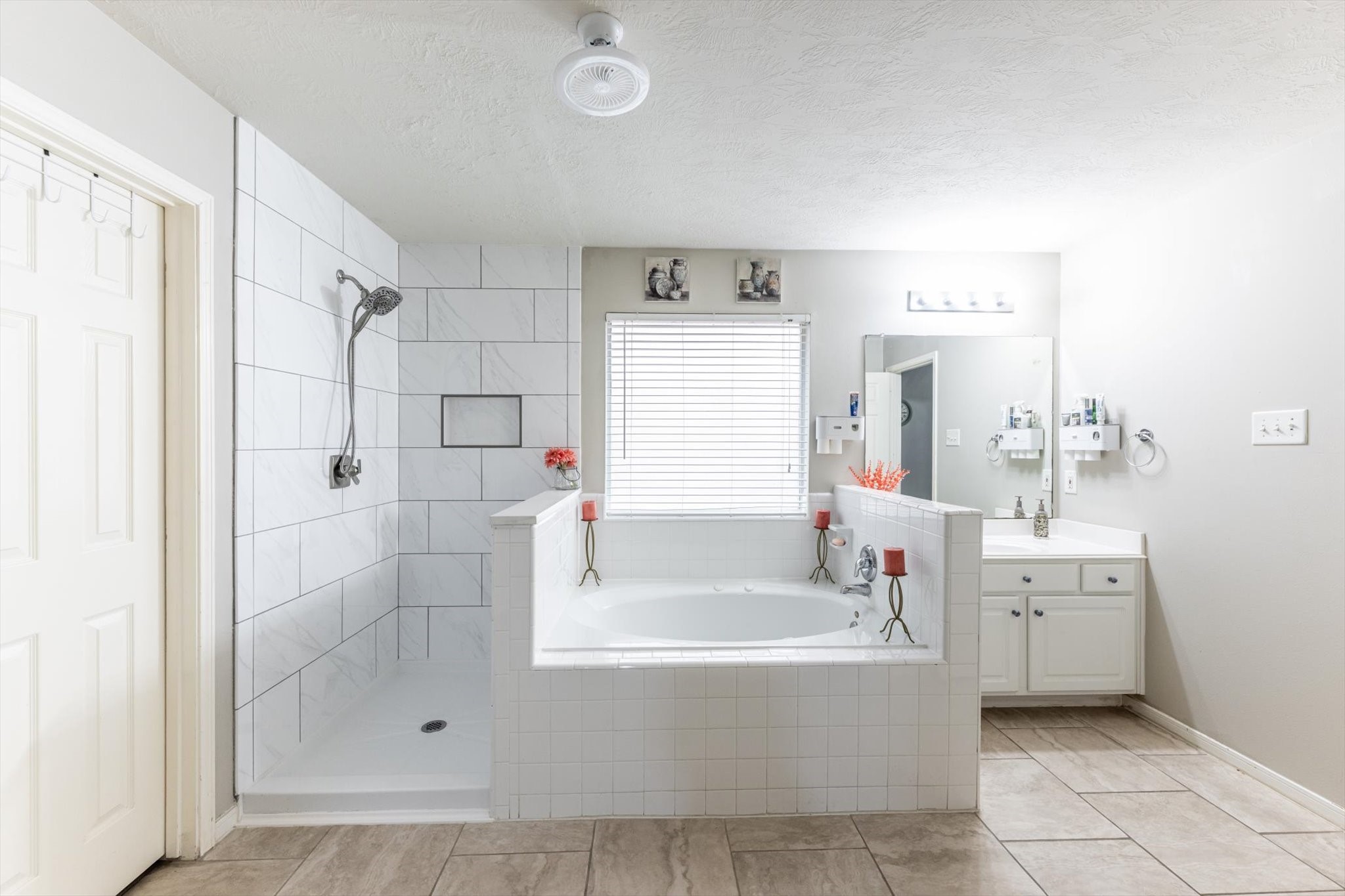13507 Beech Ridge Lane Houston, TX 77083 - Photo 28 of 49 a white bath tub sitting next to a bathroom sink