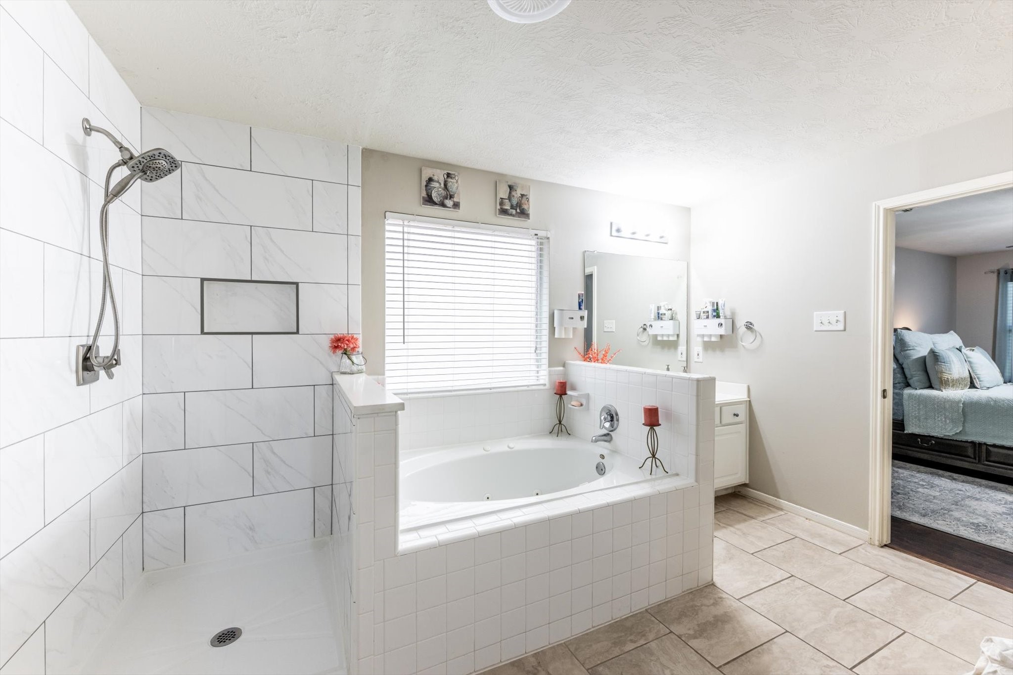 13507 Beech Ridge Lane Houston, TX 77083 - Photo 29 of 49 a bathroom with a bathtub and a shower