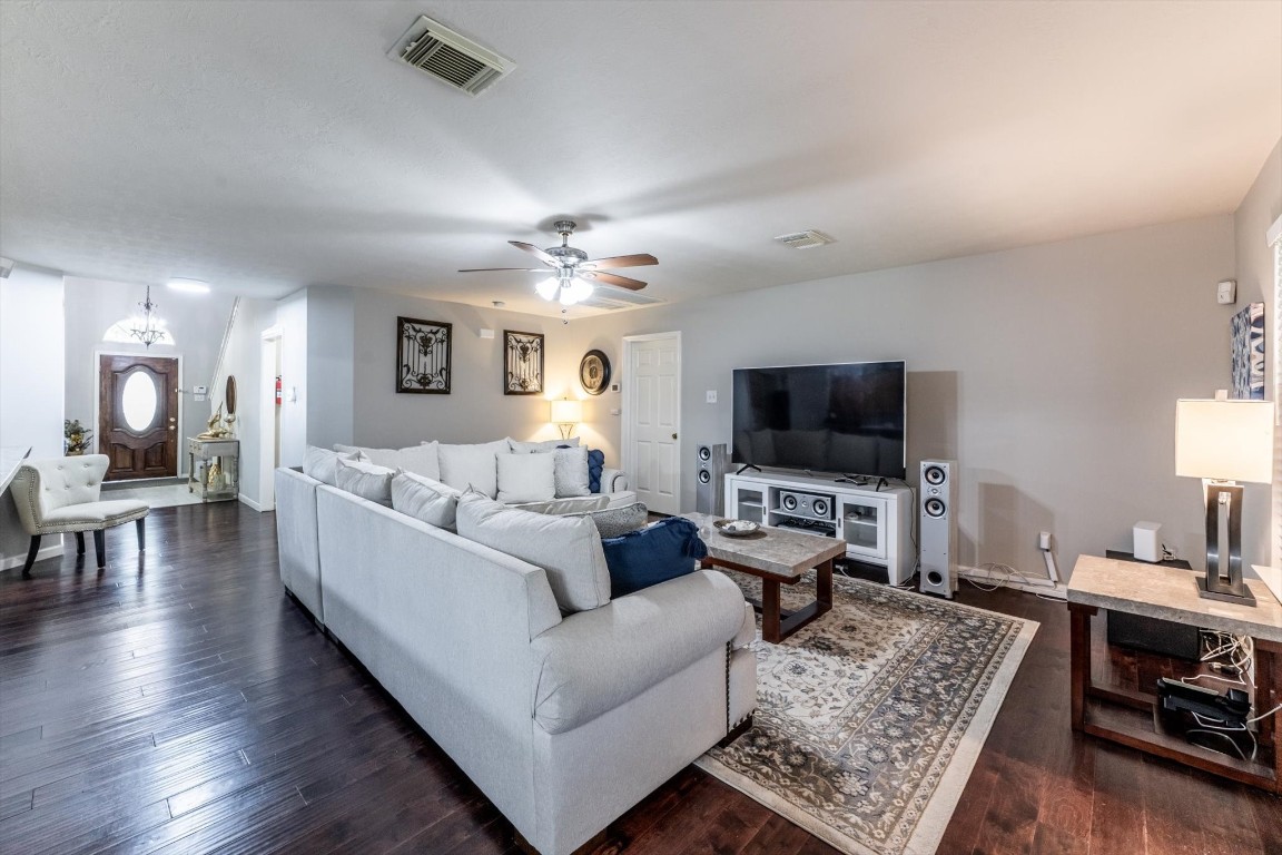 13507 Beech Ridge Lane Houston, TX 77083 - Photo 3 of 49 a living room with furniture and a flat screen tv
