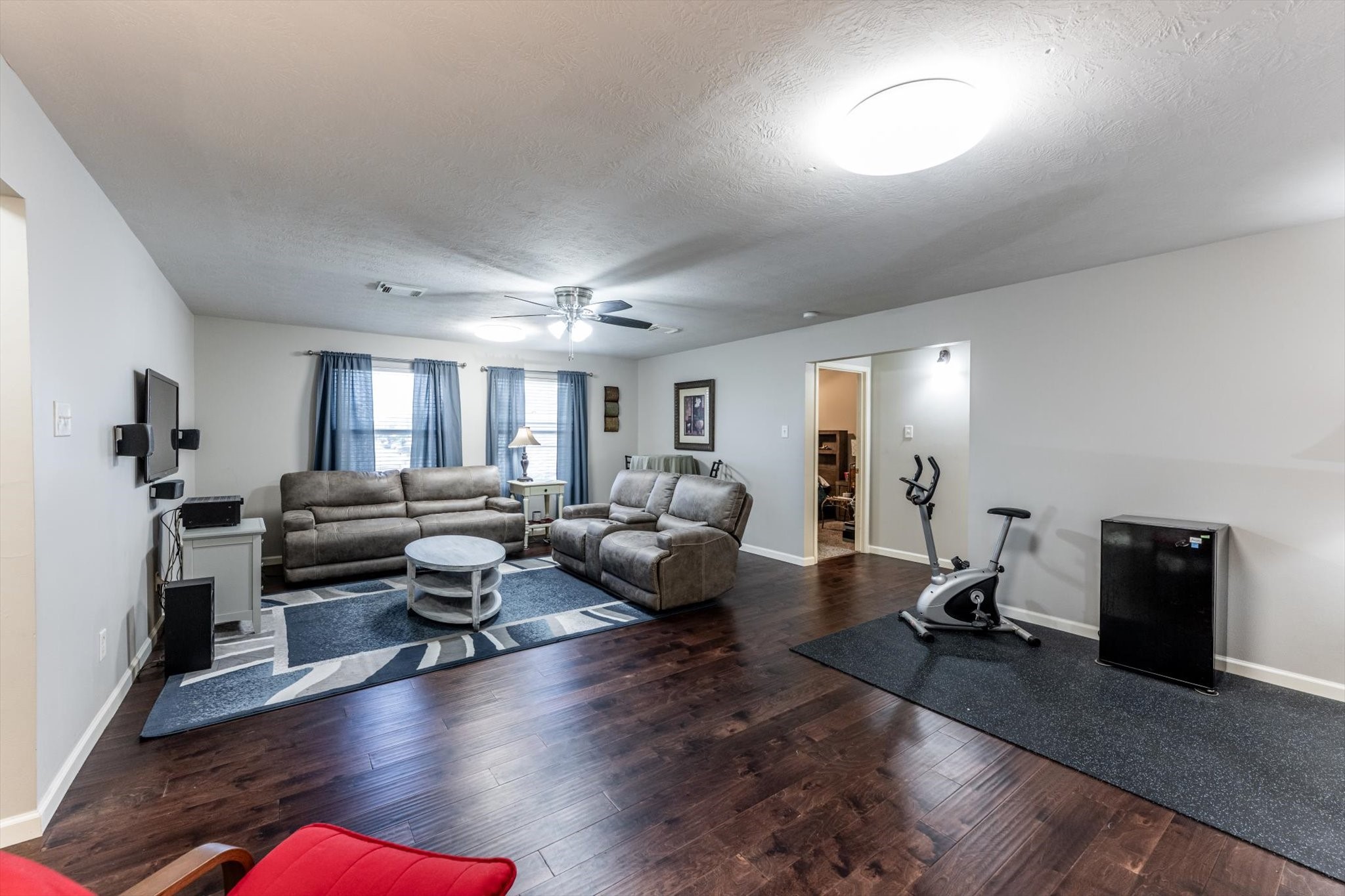13507 Beech Ridge Lane Houston, TX 77083 - Photo 32 of 49 a living room with furniture and a wooden floor