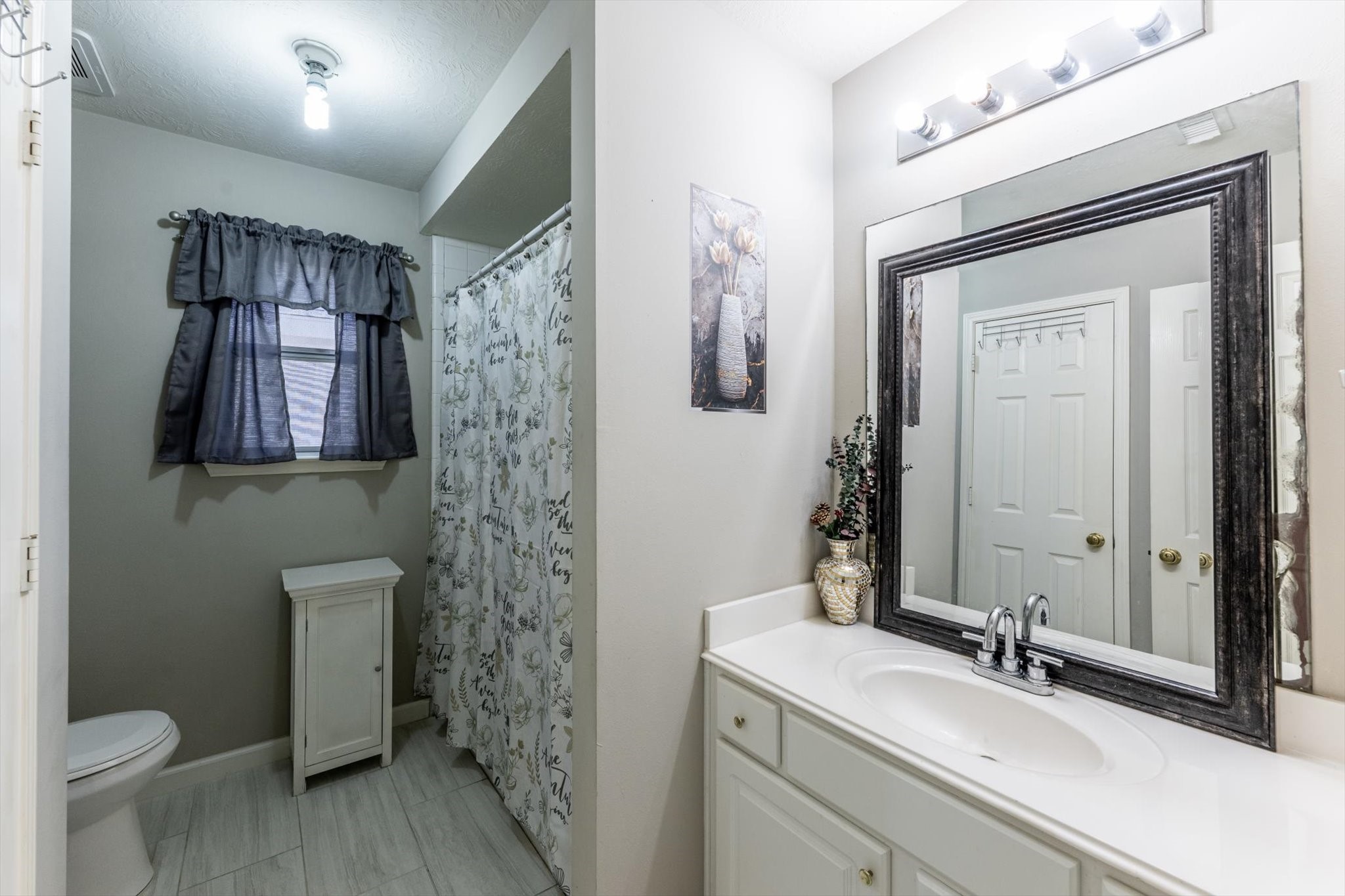 13507 Beech Ridge Lane Houston, TX 77083 - Photo 35 of 49 a bathroom with a sink a toilet and shower