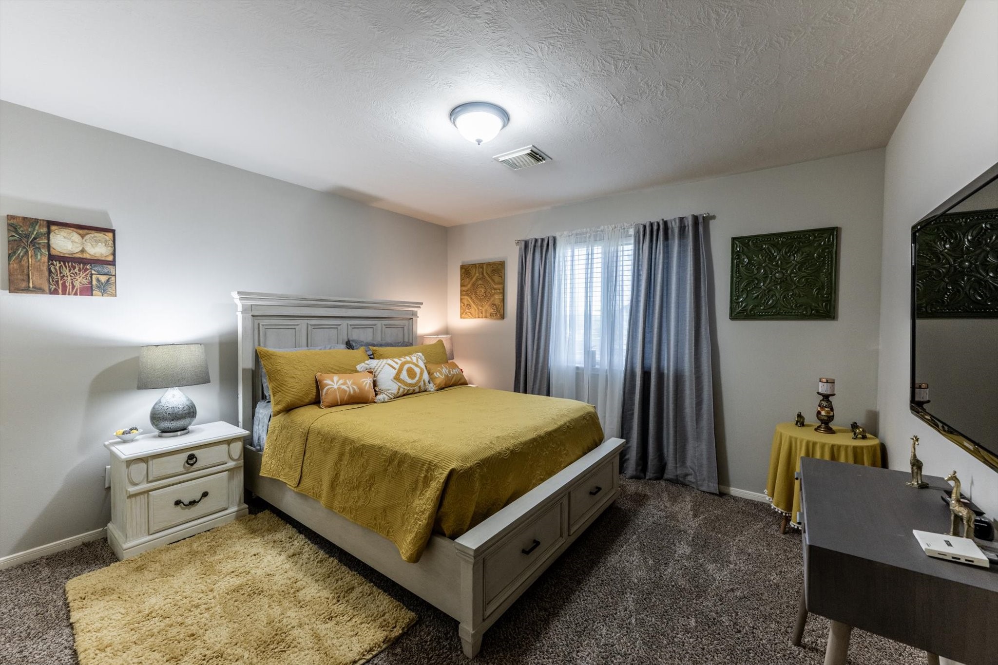 13507 Beech Ridge Lane Houston, TX 77083 - Photo 36 of 49 a bedroom with a bed and flat screen tv