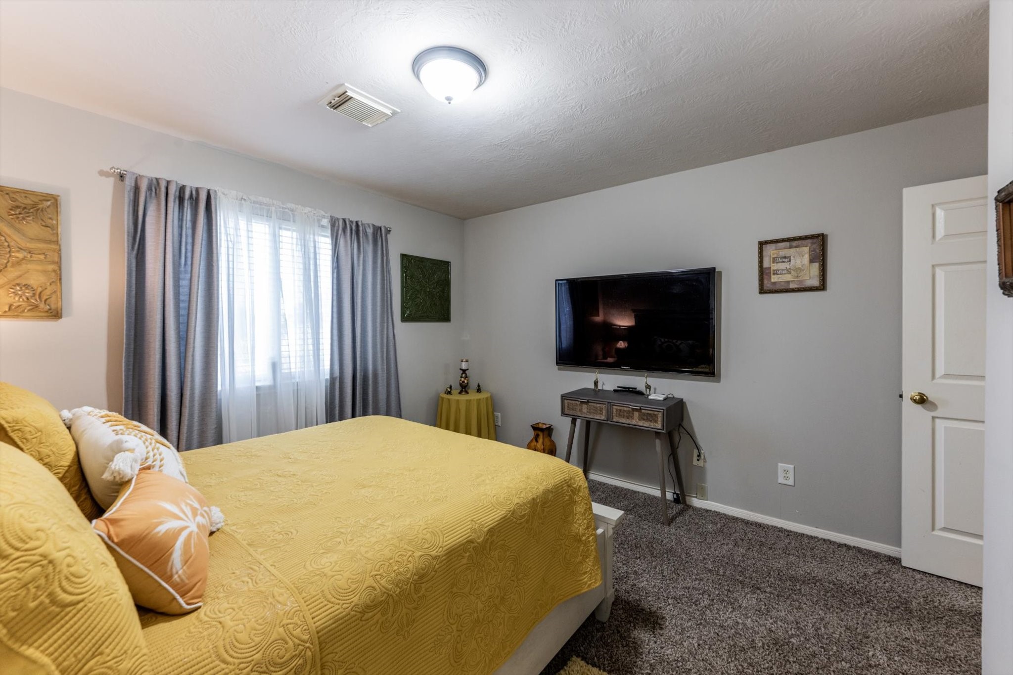 13507 Beech Ridge Lane Houston, TX 77083 - Photo 37 of 49 a bedroom with a bed and a flat screen tv