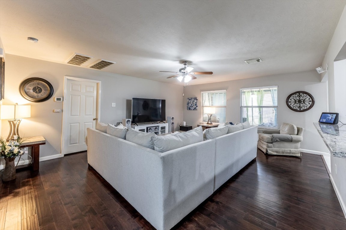 13507 Beech Ridge Lane Houston, TX 77083 - Photo 4 of 49 a living room with furniture and a flat screen tv