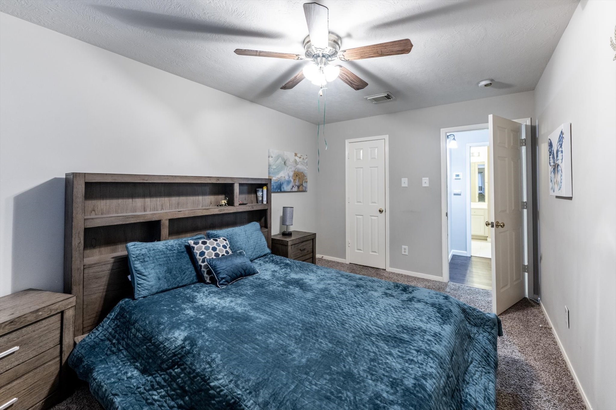13507 Beech Ridge Lane Houston, TX 77083 - Photo 41 of 49 a bed room with a bed and a ceiling fan