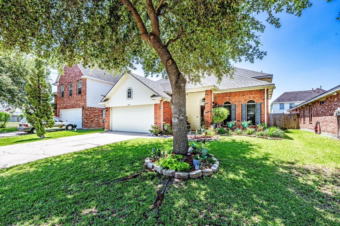 13507 Beech Ridge Lane Houston, TX 77083 - Photo 45 of 49 a front view of a house with garden