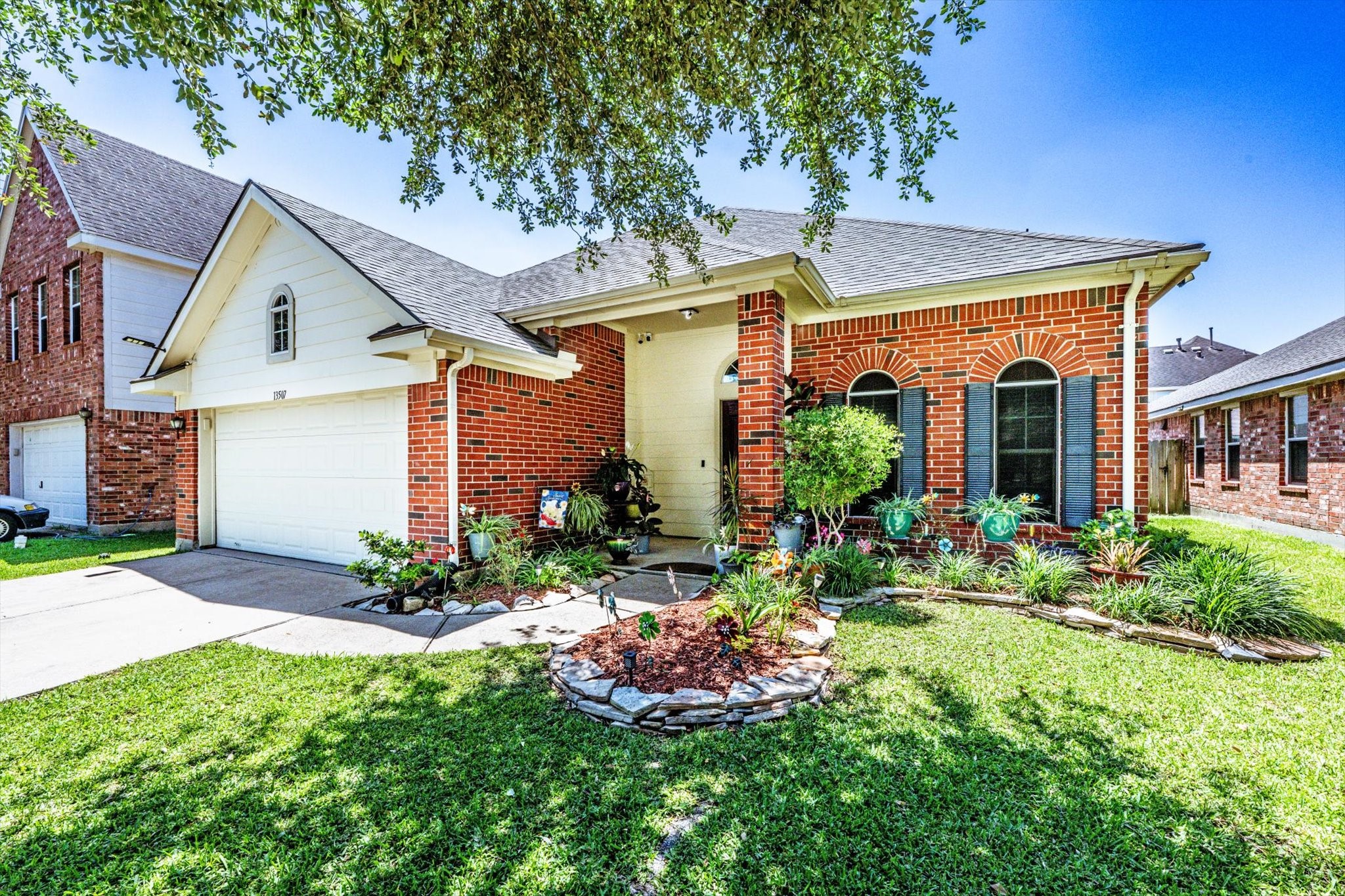 13507 Beech Ridge Lane Houston, TX 77083 - Photo 6 of 49 front view of a house with a yard