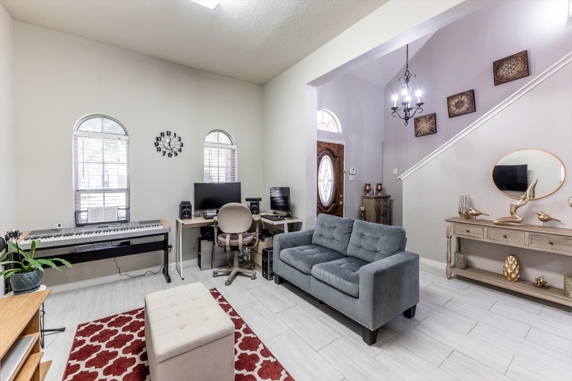 13507 Beech Ridge Lane Houston, TX 77083 - Photo 10 of 49 a living room with furniture and wooden floor