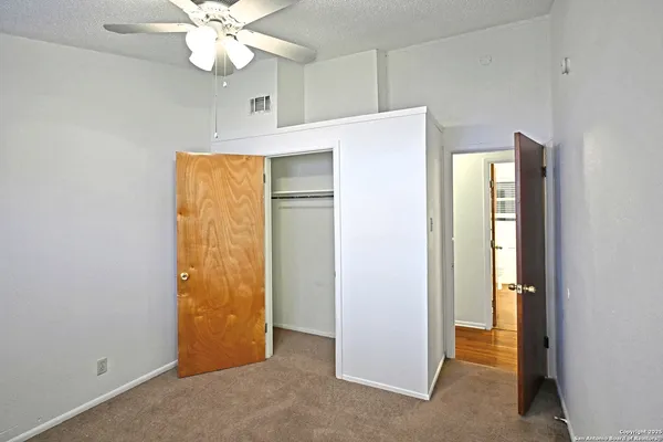 a view of an empty room with a bathroom