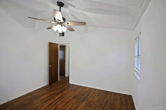 a view of entryway with a chandelier fan