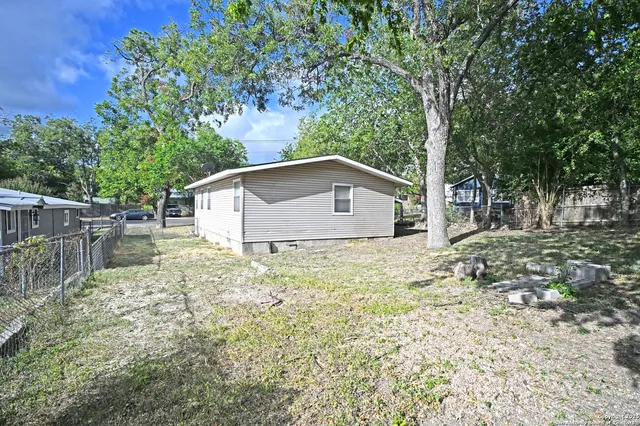 a house view with a backyard space