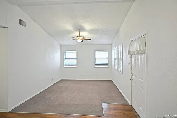 a view of an empty room with a window