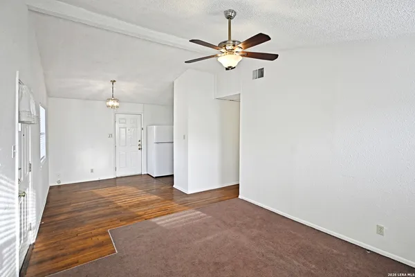 a view of a chandelier fan and a ceiling fan