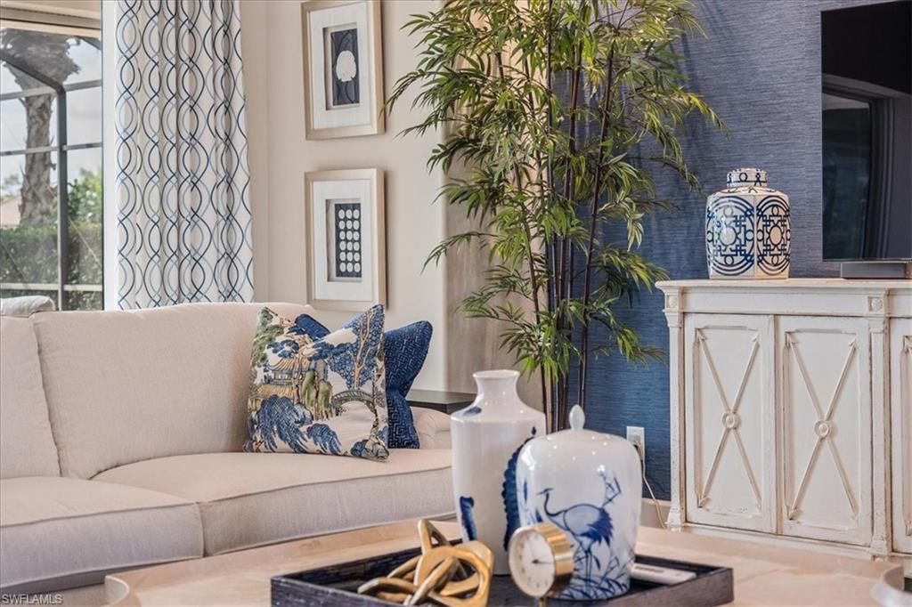 12130 Wicklow Lane Naples, FL 34120 - Photo 1 of 45 a living room with furniture and a potted plant