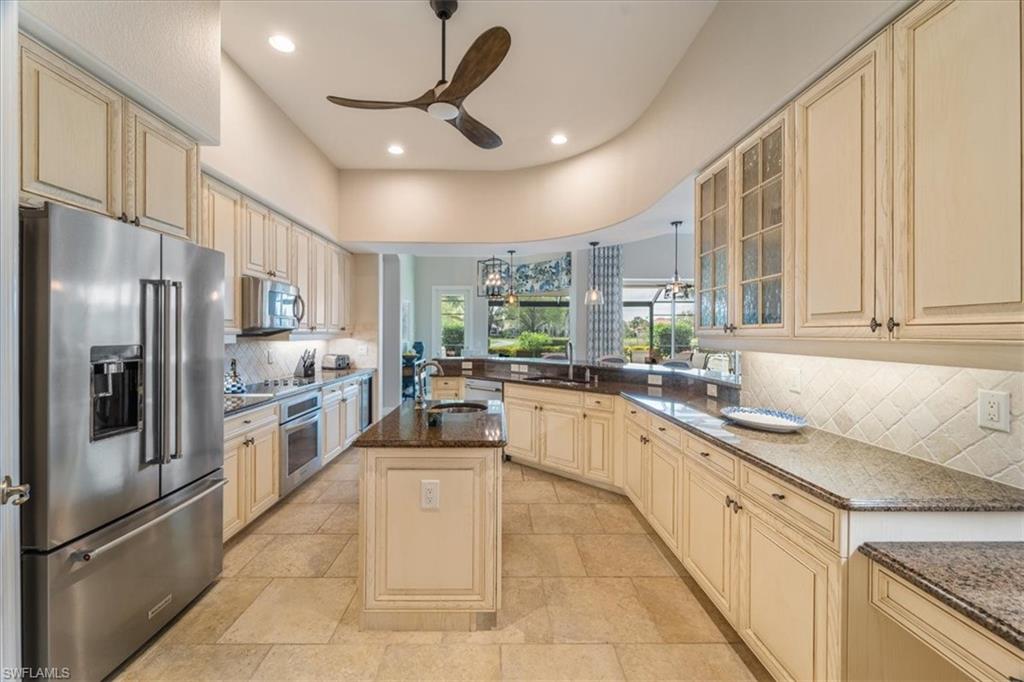 12130 Wicklow Lane Naples, FL 34120 - Photo 12 of 45 a large kitchen with stainless steel appliances lots of counter space cabinets and a large window