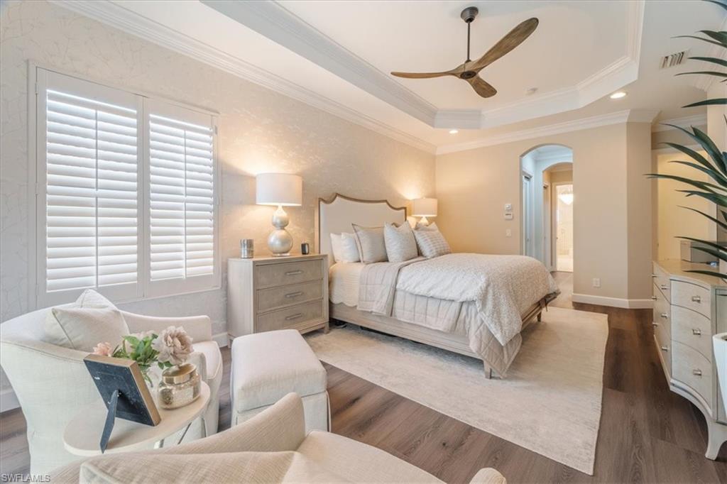 12130 Wicklow Lane Naples, FL 34120 - Photo 22 of 45 a bedroom with a bed couch and a window