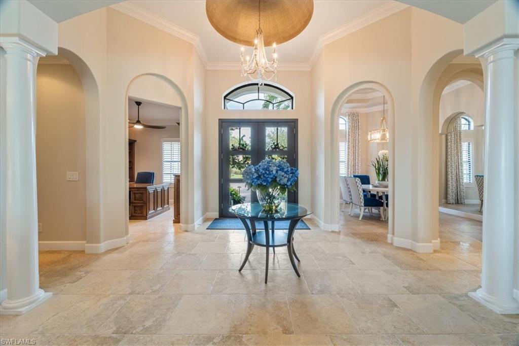 12130 Wicklow Lane Naples, FL 34120 - Photo 3 of 45 a view of a entryway door with a chandelier