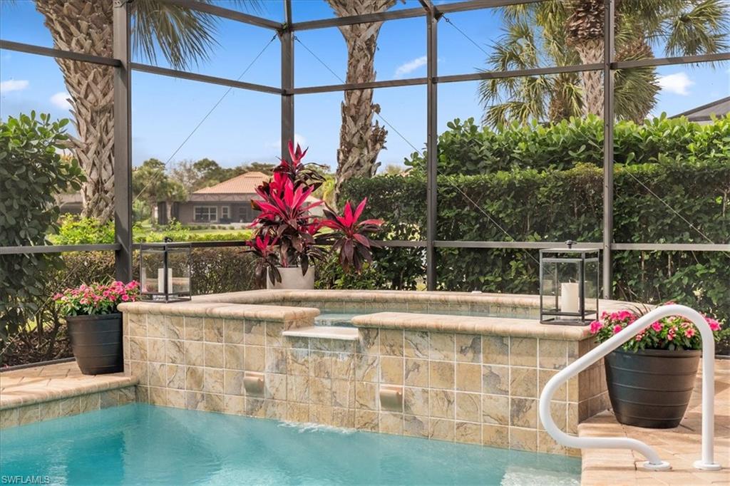 12130 Wicklow Lane Naples, FL 34120 - Photo 35 of 45 a front view of a house with a fountain