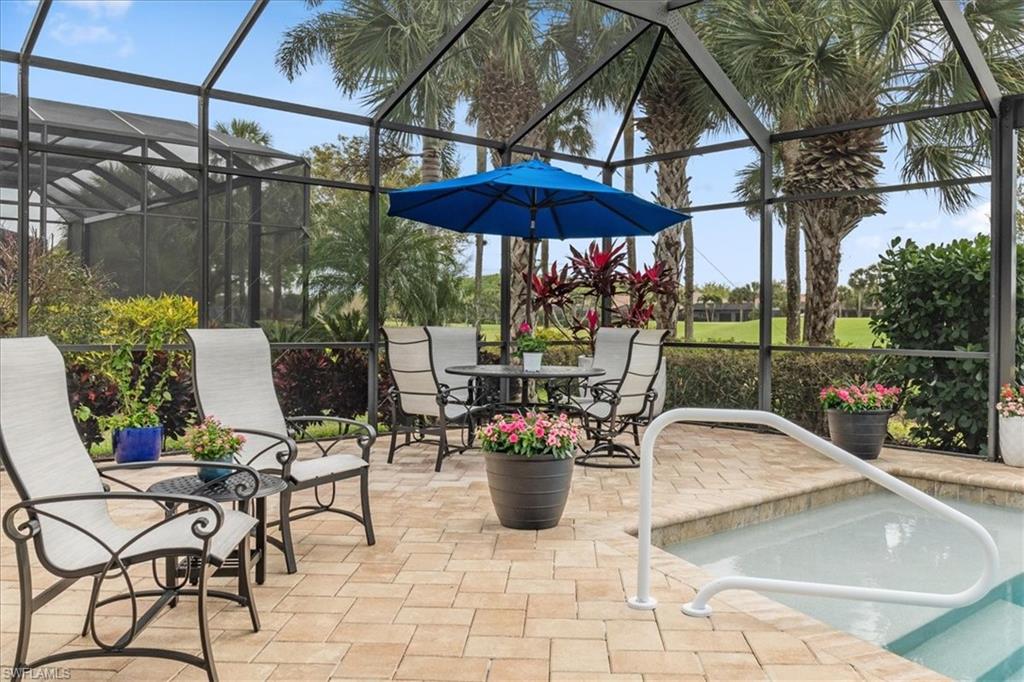 12130 Wicklow Lane Naples, FL 34120 - Photo 37 of 45 a view of a chair and tables in the patio
