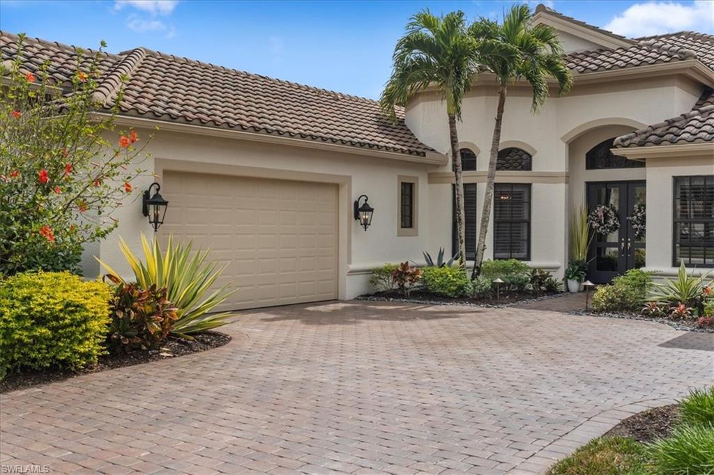 12130 Wicklow Lane Naples, FL 34120 - Photo 41 of 45 a front view of a house with garden