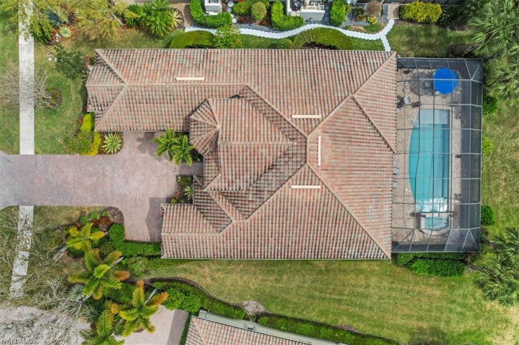 12130 Wicklow Lane Naples, FL 34120 - Photo 42 of 45 a aerial view of a house with a garden and plants