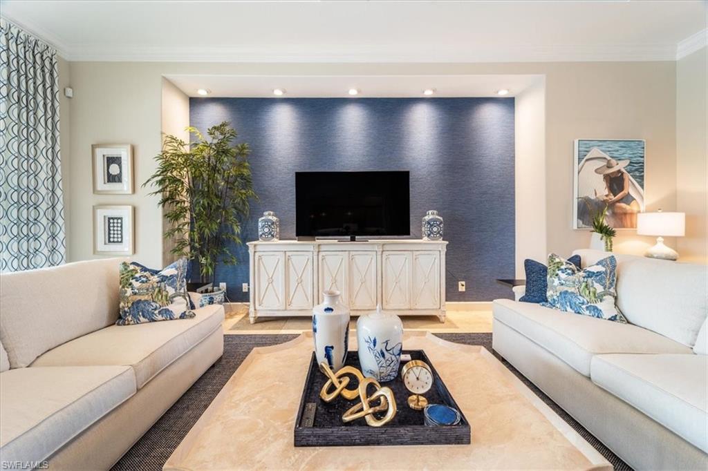 12130 Wicklow Lane Naples, FL 34120 - Photo 5 of 45 a living room with furniture and a flat screen tv