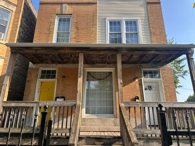a view of a house with porch and wooden floor